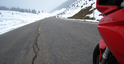 Ducati Multistrada Riding over a mountain in the snow