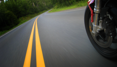 motorcycle trail braking into a corner